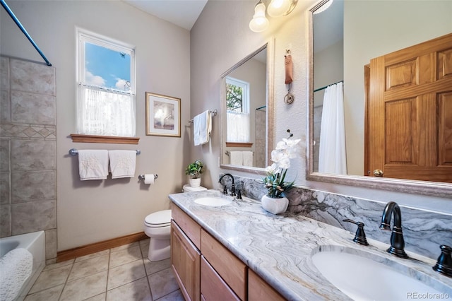 full bathroom featuring shower / bath combo, plenty of natural light, toilet, and tile patterned floors