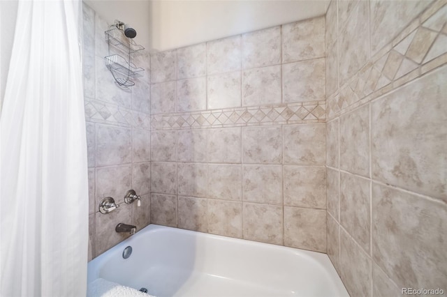 bathroom with shower / bathtub combination with curtain