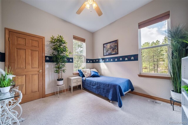 carpeted bedroom featuring ceiling fan