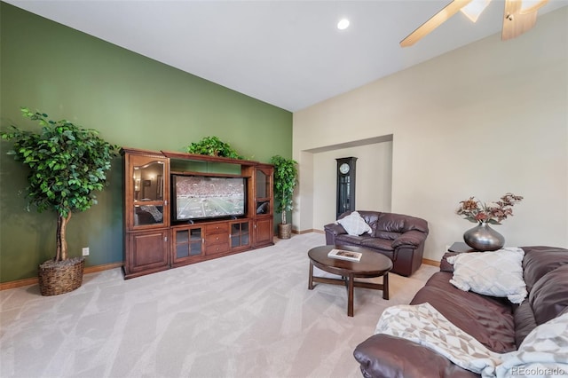 carpeted living room featuring ceiling fan