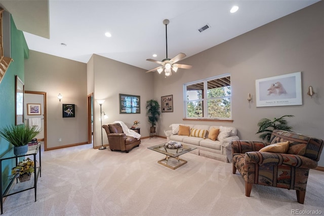 carpeted living room featuring vaulted ceiling and ceiling fan