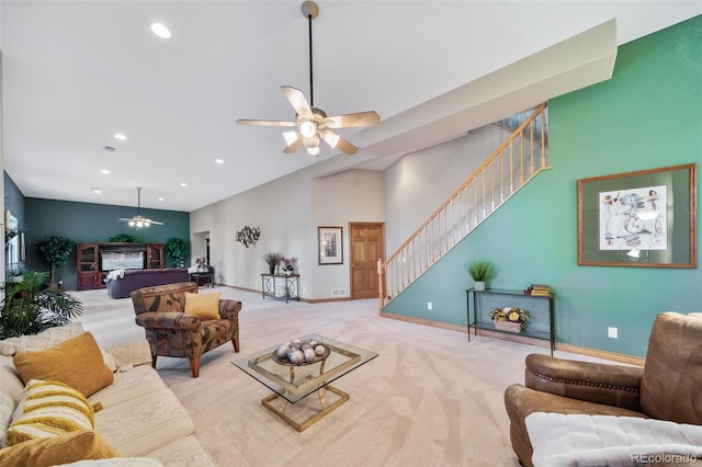 carpeted living room featuring ceiling fan