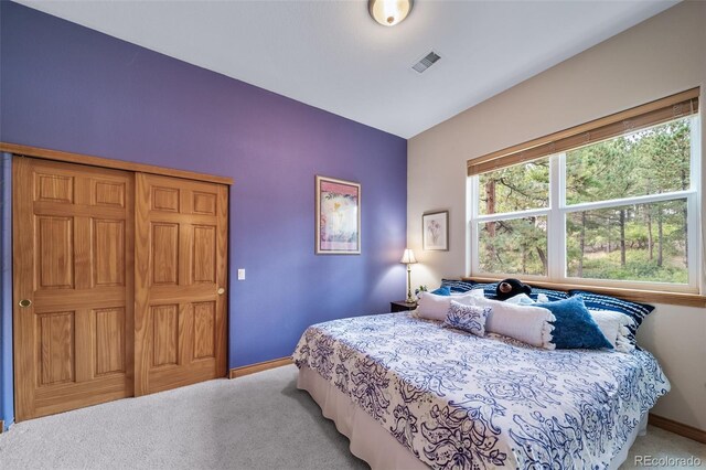 bedroom featuring light carpet