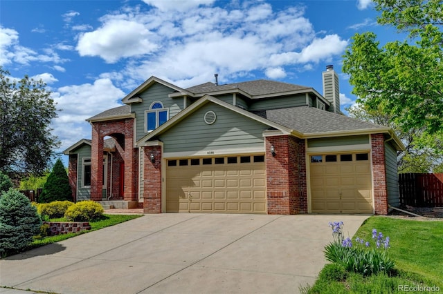 8286 W 108th Pl, Westminster, CO 80021 - traditional home with an attached garage, concrete driveway, brick siding, and a chimney