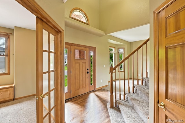 8286 W 108th Pl, Westminster, CO 80021 - foyer with stairs, light wood-type flooring, and a high ceiling