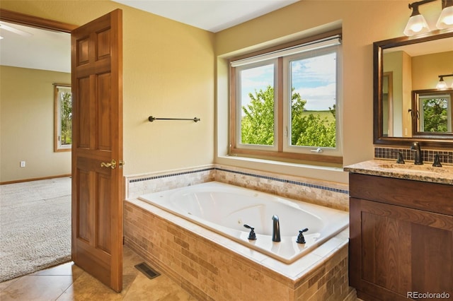 8286 W 108th Pl, Westminster, CO 80021 - full bathroom featuring a jetted tub, vanity, and tile patterned floors