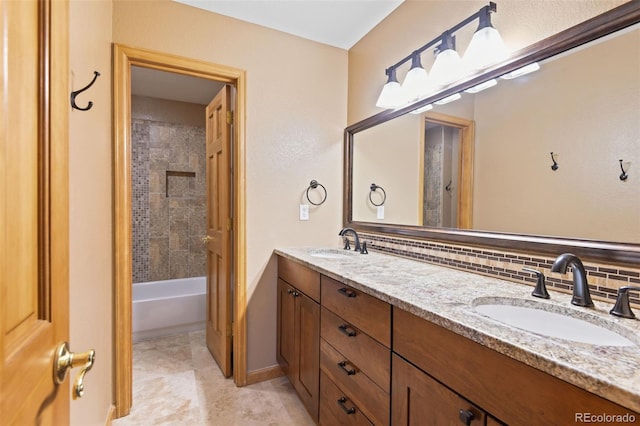 8286 W 108th Pl, Westminster, CO 80021 - bathroom with double vanity, tasteful backsplash, tile patterned floors, and tub / shower combination