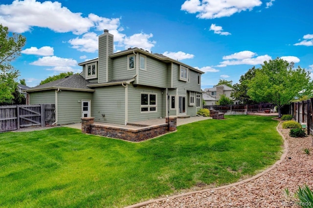 8286 W 108th Pl, Westminster, CO 80021 - back of property with a chimney, a patio area, a fenced backyard, and a gate