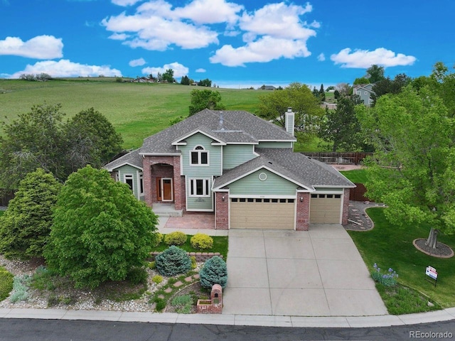 8286 W 108th Pl, Westminster, CO 80021 - traditional-style home featuring brick siding, an attached garage, driveway, and a front yard
