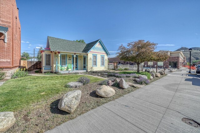 332 F St, Salida, CO 81201 - victorian home with a porch and a shingled roof