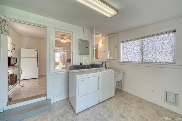 332 F St, Salida, CO 81201 - laundry room with independent washer and dryer, electric panel, healthy amount of natural light, and baseboards