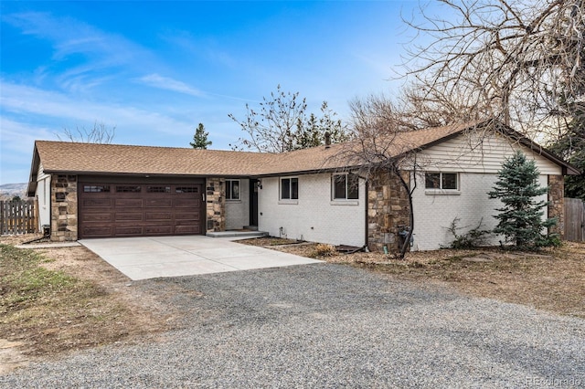 14290 W 54th Ave, Arvada, CO 80002 - single story home featuring concrete driveway, a garage, brick siding, roof with shingles, and stone siding