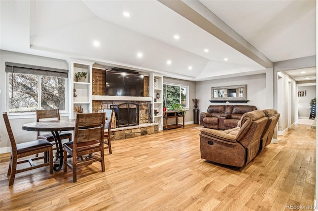 14290 W 54th Ave, Arvada, CO 80002 - living room featuring light wood-type flooring, baseboards, a fireplace, recessed lighting, and vaulted ceiling