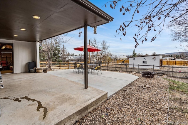 14290 W 54th Ave, Arvada, CO 80002 - fenced backyard with a patio, outdoor dining area, and an outdoor fire pit