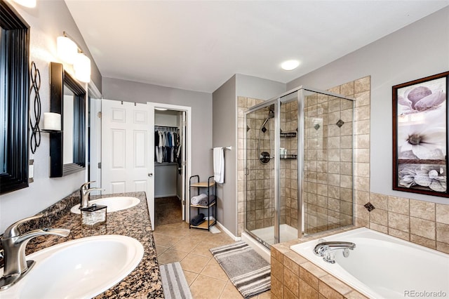 5794 S Yakima Way, Aurora, CO 80015 - full bath with a shower stall, a bath, tile patterned flooring, and double vanity
