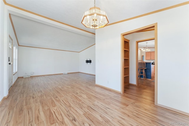 2019 S Fox St, Denver, CO 80223 - empty room featuring a chandelier, wood finished floors, and ornamental molding