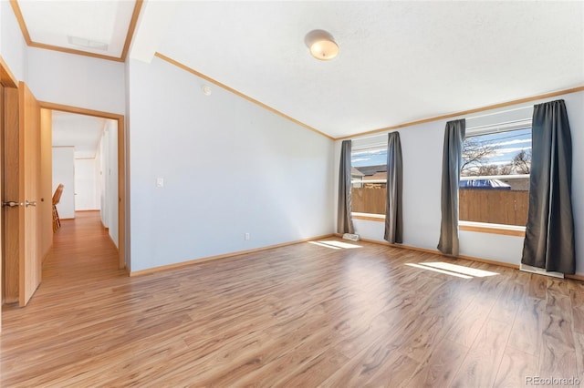 2019 S Fox St, Denver, CO 80223 - unfurnished room with light wood-style floors, crown molding, and vaulted ceiling
