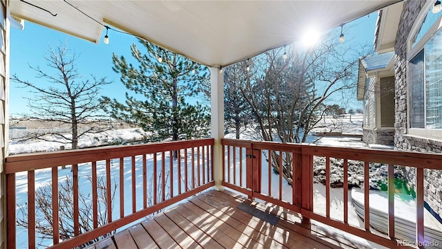 view of snow covered deck