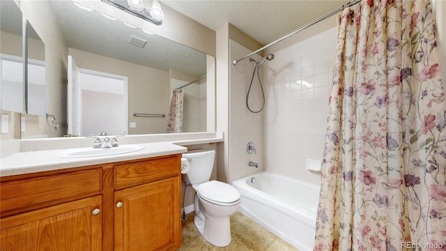 full bathroom with vanity, shower / bath combination with curtain, a textured ceiling, and toilet