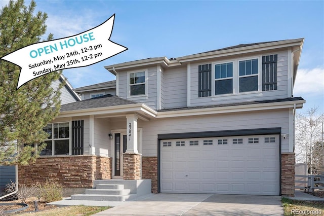23841 E Alabama Dr, Aurora, CO 80018 - view of front of house featuring an attached garage, driveway, and stone siding