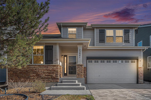 23841 E Alabama Dr, Aurora, CO 80018 - view of front of house with an attached garage, driveway, and entry steps