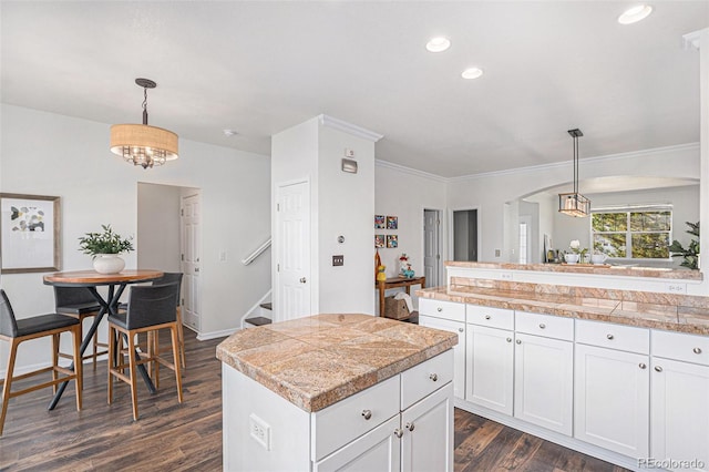 23841 E Alabama Dr, Aurora, CO 80018 - kitchen with tile countertops, dark wood finished floors, white cabinetry, pendant lighting, and recessed lighting