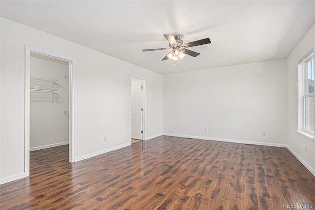 23841 E Alabama Dr, Aurora, CO 80018 - empty room with dark wood-style flooring, ceiling fan, and baseboards