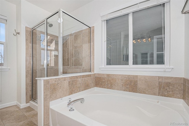 23841 E Alabama Dr, Aurora, CO 80018 - bathroom with a shower stall, a garden tub, and baseboards