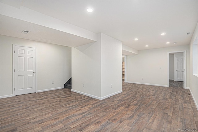 23841 E Alabama Dr, Aurora, CO 80018 - finished below grade area with wood finished floors, stairway, recessed lighting, and baseboards