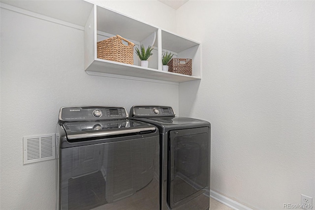 23841 E Alabama Dr, Aurora, CO 80018 - laundry room with washing machine and clothes dryer