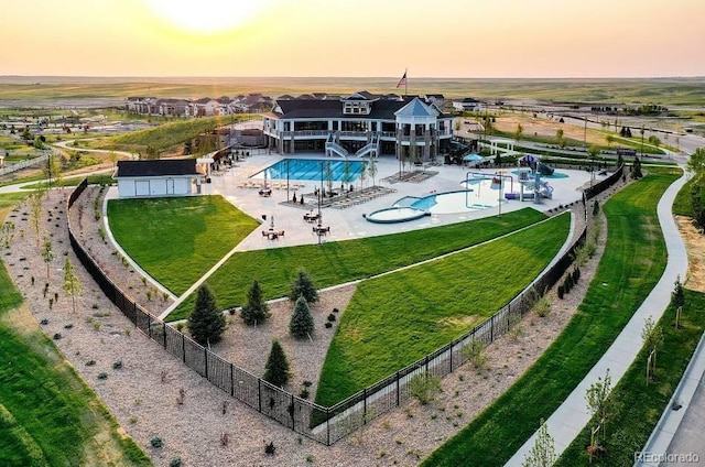view of subject property with a pool area