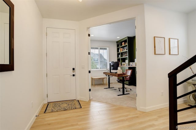entrance foyer with light wood finished floors, baseboards, and recessed lighting