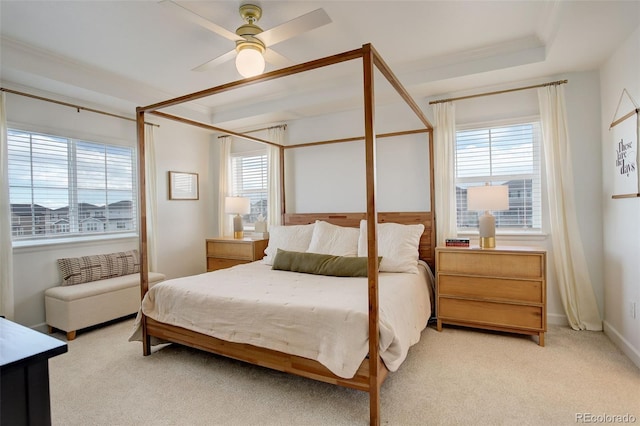 bedroom with light colored carpet and a ceiling fan