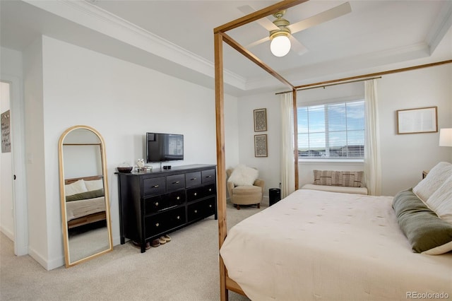 bedroom featuring crown molding, light colored carpet, a ceiling fan, and baseboards