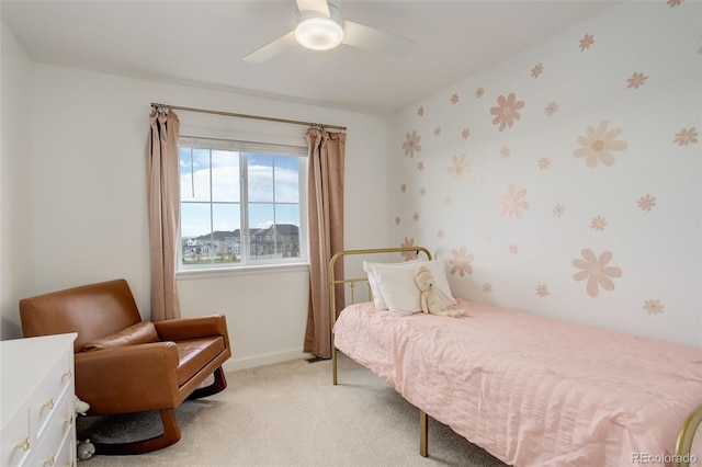 bedroom with light carpet, baseboards, and ceiling fan