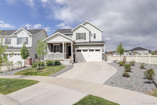 craftsman inspired home featuring board and batten siding, fence, concrete driveway, a porch, and a garage