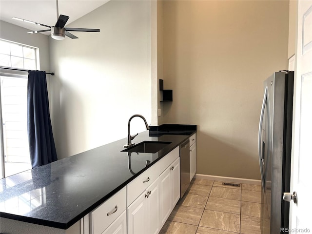 1470 S Quebec Way Unit 275, Denver, CO 80231 - kitchen with appliances with stainless steel finishes, a sink, ceiling fan, white cabinetry, and a peninsula