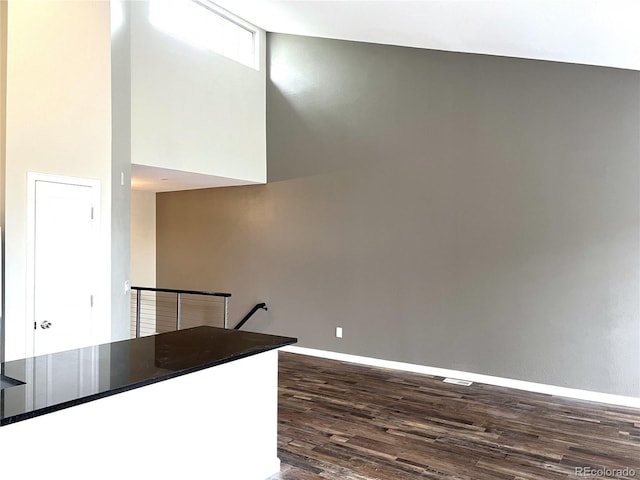 1470 S Quebec Way Unit 275, Denver, CO 80231 - interior space with dark wood-type flooring, baseboards, and dark countertops