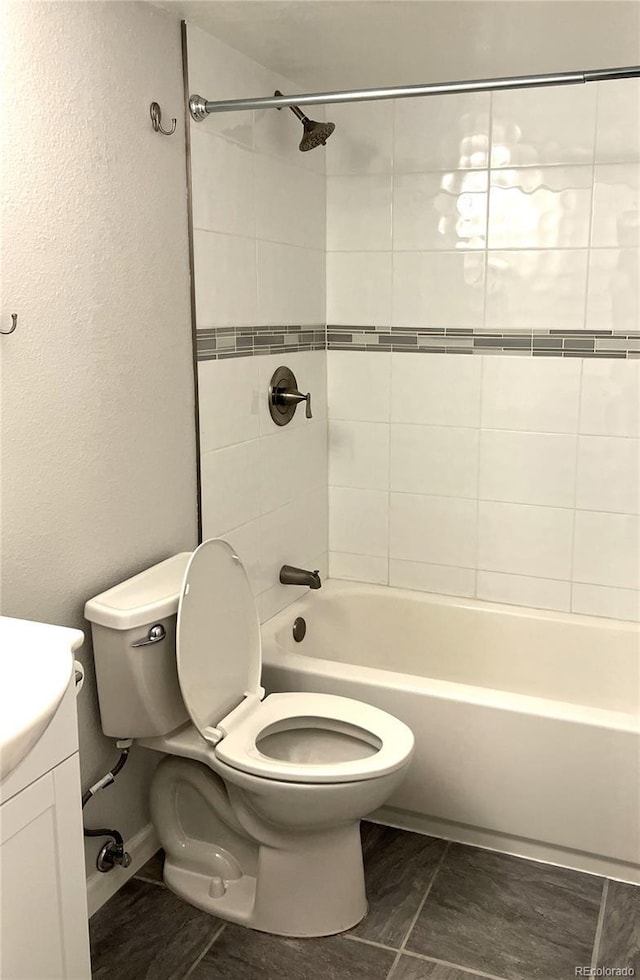 1470 S Quebec Way Unit 275, Denver, CO 80231 - bathroom featuring toilet, shower / bathtub combination, vanity, and a textured wall