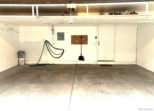 1470 S Quebec Way Unit 275, Denver, CO 80231 - garage featuring a garage door opener and electric panel