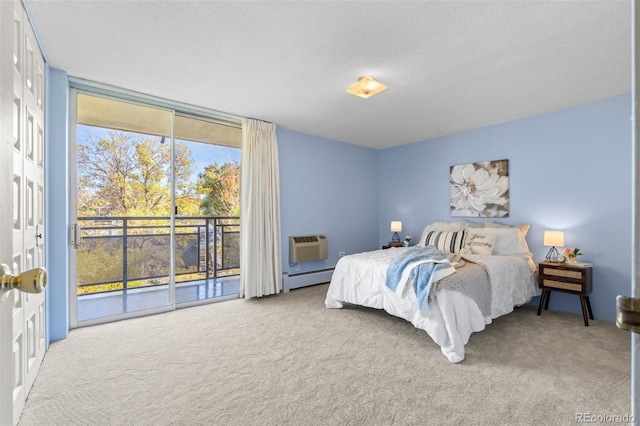 carpeted bedroom featuring access to exterior, a textured ceiling, a wall mounted air conditioner, and baseboard heating