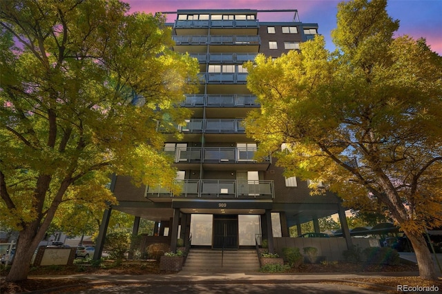 view of outdoor building at dusk