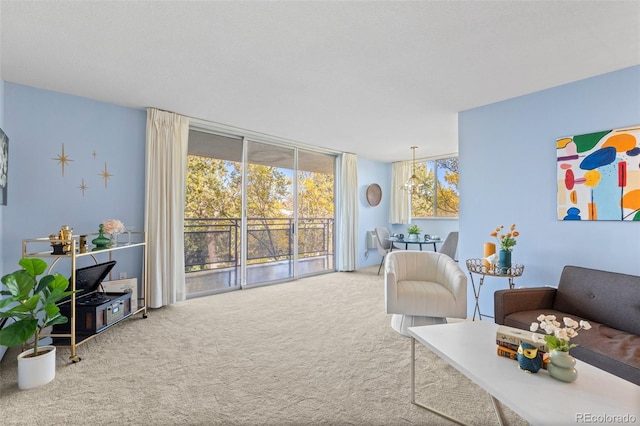 interior space with a chandelier and carpet floors