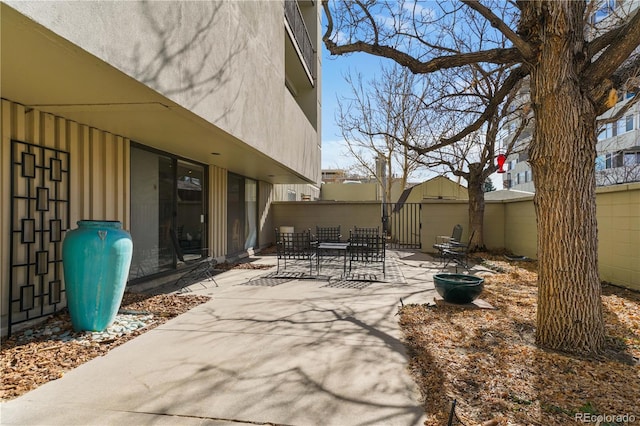 view of patio / terrace featuring fence