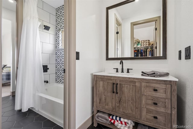 full bathroom with tile patterned flooring, vanity, and shower / bath combo with shower curtain