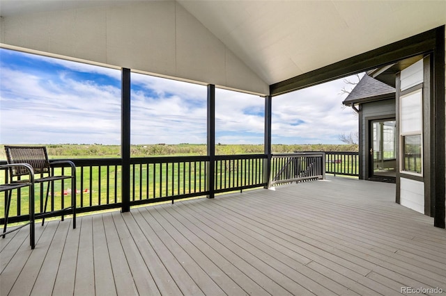 wooden deck featuring a lawn
