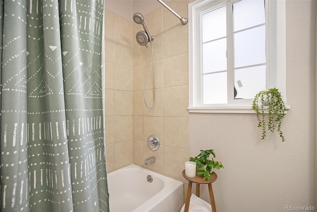 full bath featuring shower / bath combination with curtain and a healthy amount of sunlight