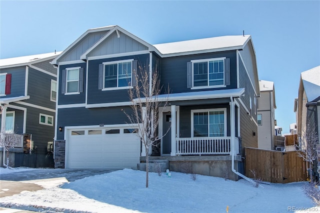 view of front of home featuring a porch, an attached garage, board and batten siding, and fence