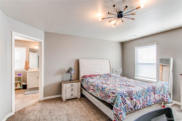 bedroom featuring a textured ceiling, carpet, visible vents, and baseboards