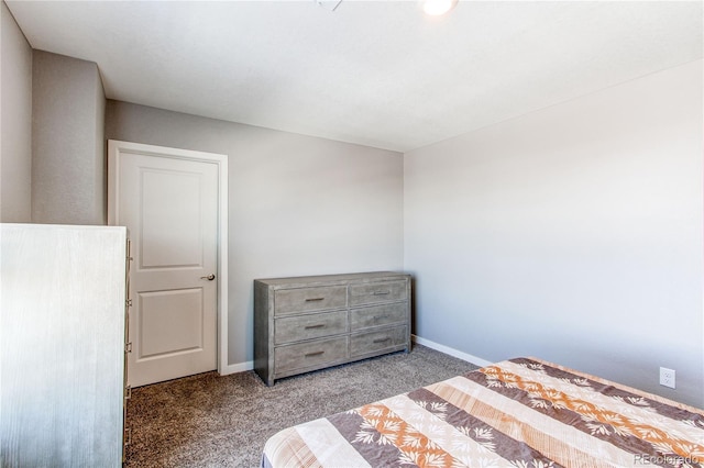 unfurnished bedroom featuring baseboards and carpet floors